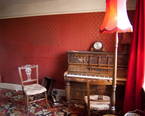 Piano and empty chair